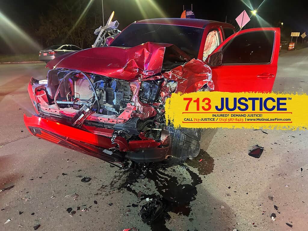 Red Toyota Tundra truck in a serious truck accident where airbags deployed in Houston Texas. 713-Justice.